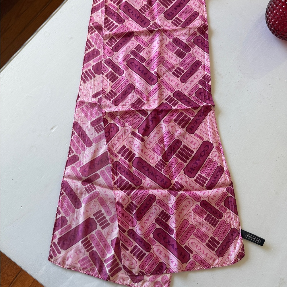 Coach silk scarf in Pink and Purple. 10” wide 58” long. 100% silk. In excellent